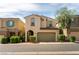 Charming two-story home featuring a cozy front porch and two-car garage at 10229 Mayflower Bay Ave, Las Vegas, NV 89166