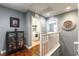 Inviting hallway featuring wood floors, leading to the laundry room and bedroom at 10229 Mayflower Bay Ave, Las Vegas, NV 89166