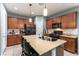 Modern kitchen with granite countertops, stainless steel appliances, and island with seating at 10229 Mayflower Bay Ave, Las Vegas, NV 89166