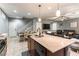 Well-designed kitchen seamlessly flowing into the living and dining areas at 10229 Mayflower Bay Ave, Las Vegas, NV 89166