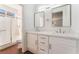 Bright bathroom features double sinks, modern mirrors, and shower at 10505 Jeremy Ridge Ave, Las Vegas, NV 89144