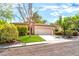 Inviting single-story home with a manicured lawn and a convenient two-car garage at 10505 Jeremy Ridge Ave, Las Vegas, NV 89144