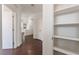 Hallway with open shelving, wood floors, and natural light at 10505 Jeremy Ridge Ave, Las Vegas, NV 89144