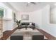 Well-lit living room featuring a modern sofa, area rug and contemporary decor at 10505 Jeremy Ridge Ave, Las Vegas, NV 89144