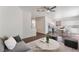 Open-concept living space leading to the kitchen and dining area with modern furnishings at 10505 Jeremy Ridge Ave, Las Vegas, NV 89144