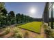 A beautifully landscaped backyard with lush green grass and manicured shrubs at 10781 Agate Cliffs Ave, Las Vegas, NV 89135