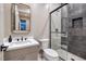Modern bathroom featuring a glass enclosed shower with tasteful tile work and single sink vanity at 10781 Agate Cliffs Ave, Las Vegas, NV 89135