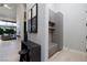 Inviting entryway with modern console table, bench stool, and custom built-in cabinets for storage at 10781 Agate Cliffs Ave, Las Vegas, NV 89135