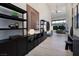 Stylish hallway with modern furnishings and decor, leading to an open-concept living area at 10781 Agate Cliffs Ave, Las Vegas, NV 89135