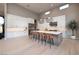 Spacious modern kitchen with white cabinetry, stainless steel appliances, and stylish island seating at 10781 Agate Cliffs Ave, Las Vegas, NV 89135