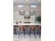 Modern kitchen island with pendant lighting and seating at 10781 Agate Cliffs Ave, Las Vegas, NV 89135