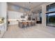 Bright, open kitchen with island seating, stainless appliances, and easy access to the outdoor area at 10781 Agate Cliffs Ave, Las Vegas, NV 89135