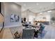 Expansive open-concept living room with high ceilings, modern decor, and seamless flow to the kitchen at 10781 Agate Cliffs Ave, Las Vegas, NV 89135