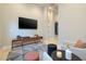 Bright living room featuring a large flat-screen TV and modern decor at 10781 Agate Cliffs Ave, Las Vegas, NV 89135