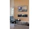 Close up of a stylish living room showcasing the accent wall with fireplace and comfortable seating at 10781 Agate Cliffs Ave, Las Vegas, NV 89135