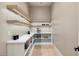 Well-lit walk-in pantry with custom shelving at 10781 Agate Cliffs Ave, Las Vegas, NV 89135