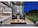 Inviting outdoor patio with comfortable seating and seamless transition to the modern kitchen at 10781 Agate Cliffs Ave, Las Vegas, NV 89135