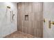 Beautiful shower with detailed tile work and brass fixtures at 10781 Agate Cliffs Ave, Las Vegas, NV 89135