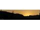 Tranquil sunset landscape featuring silhouette of distant mountains at 10781 Agate Cliffs Ave, Las Vegas, NV 89135