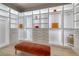 Spacious walk-in closet with custom shelving, built in drawers and ample storage at 10781 Agate Cliffs Ave, Las Vegas, NV 89135