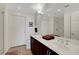 Bright bathroom with dual sinks, a large mirror, and a separate shower and toilet area at 150 Las Vegas Blvd # 1503, Las Vegas, NV 89101