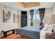 This sunlit bedroom includes hardwood floors, and large windows with city views at 150 Las Vegas Blvd # 1503, Las Vegas, NV 89101