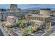 Charming cityscape view showcases the Gold Spike hotel, a swimming pool, and surrounding urban buildings against mountain backdrop at 150 Las Vegas Blvd # 1503, Las Vegas, NV 89101