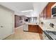 Stylish kitchen featuring wood cabinets, stainless steel appliances, and bright countertops, seamlessly flowing into the living area at 150 Las Vegas Blvd # 1503, Las Vegas, NV 89101