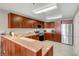 Well-lit kitchen featuring wood cabinets, stainless steel appliances and light countertop at 150 Las Vegas Blvd # 1503, Las Vegas, NV 89101