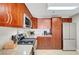Modern kitchen with stainless steel appliances, light granite countertops, and wooden cabinetry at 150 Las Vegas Blvd # 1503, Las Vegas, NV 89101