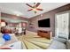 Spacious living area with access to a balcony, a large TV, and comfortable seating arrangements at 150 Las Vegas Blvd # 1503, Las Vegas, NV 89101
