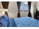 Close-up view of a bedroom highlighting a large window with panoramic city views at 150 Las Vegas Blvd # 1503, Las Vegas, NV 89101