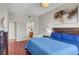 Well-lit bedroom with hardwood floors, a seating area, and an en-suite bathroom at 150 Las Vegas Blvd # 1503, Las Vegas, NV 89101