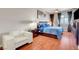 Inviting primary bedroom with hardwood floors, city views, and a cozy sitting area at 150 Las Vegas Blvd # 1503, Las Vegas, NV 89101