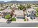 Residential area featuring a house with a spacious driveway and manicured lawn in a desirable neighborhood at 1515 Horizon Crest Ct, Henderson, NV 89012