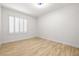 Bedroom featuring vinyl flooring, white walls, and window with shutters at 1515 Horizon Crest Ct, Henderson, NV 89012