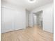 Spacious bedroom with wood floors and access to bathroom and kitchen at 1515 Horizon Crest Ct, Henderson, NV 89012