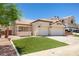 Inviting single-story home featuring a well-kept lawn and a two-car garage at 1515 Horizon Crest Ct, Henderson, NV 89012