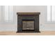 Close-up of marble fireplace with wood mantle, flanked by shuttered windows at 1515 Horizon Crest Ct, Henderson, NV 89012
