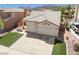 Lovely residence boasting a tidy front lawn and a convenient two-car garage in a peaceful community at 1515 Horizon Crest Ct, Henderson, NV 89012