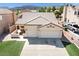 Charming single-story home with a well-maintained front yard and a two-car garage in a Gathering-friendly neighborhood at 1515 Horizon Crest Ct, Henderson, NV 89012