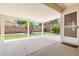 Covered patio overlooking a well-maintained backyard and artificial grass at 1515 Horizon Crest Ct, Henderson, NV 89012
