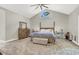 Bright bedroom with vaulted ceiling and a large window, features a comfortable bed and stylish decor at 1813 Skyline Dr, Las Vegas, NV 89117