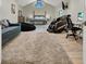 Spacious bedroom featuring a vaulted ceiling, plush carpet, and a luxurious massage chair, perfect for relaxation at 1813 Skyline Dr, Las Vegas, NV 89117