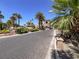 Elegant community entrance showcasing lush landscaping and a stately gatehouse at 1813 Skyline Dr, Las Vegas, NV 89117