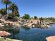 Scenic lake with cascading waterfalls and mature landscaping in a beautiful community at 1813 Skyline Dr, Las Vegas, NV 89117