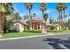 Gorgeous one-story home featuring a covered entrance and lush landscaping, enhancing its appeal at 1813 Skyline Dr, Las Vegas, NV 89117