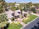 Attractive one-story home featuring lush landscaping and mature palm trees on a sunny day at 1813 Skyline Dr, Las Vegas, NV 89117