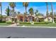 Inviting one-story home featuring a covered entrance and lush landscaping, creating curb appeal at 1813 Skyline Dr, Las Vegas, NV 89117