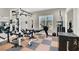 Home gym equipped with weightlifting and rowing machines, offering a convenient fitness space at 1813 Skyline Dr, Las Vegas, NV 89117
